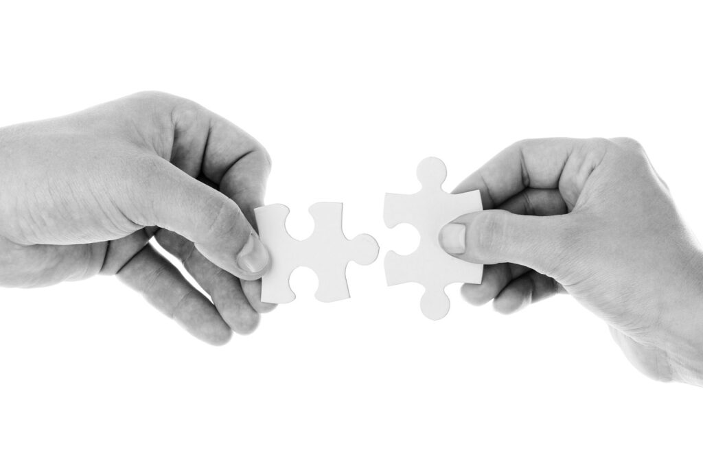 hands puzzle pieces connect 20333